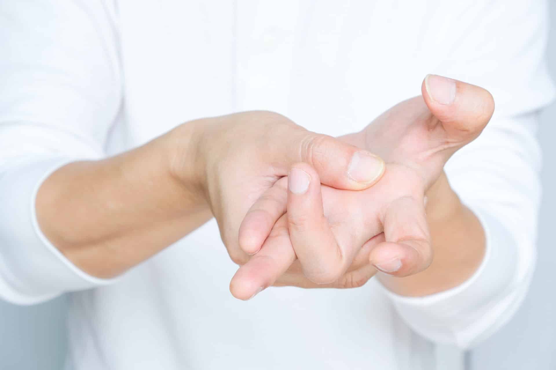 A man suffering from trigger finger. A man suffering from trigger finger