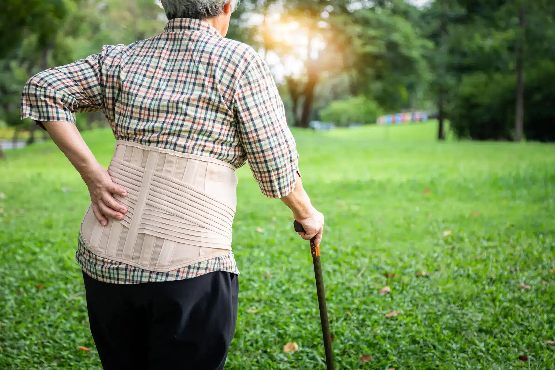 An elderly person walking while recovering from hip fracture surgery – Spire Orthopaedic Centre An elderly person walking while recovering from hip fracture surgery - Spire Orthopaedic Centre